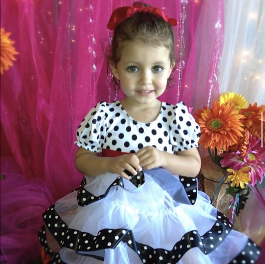 Nola as a toddler in a studio portrait